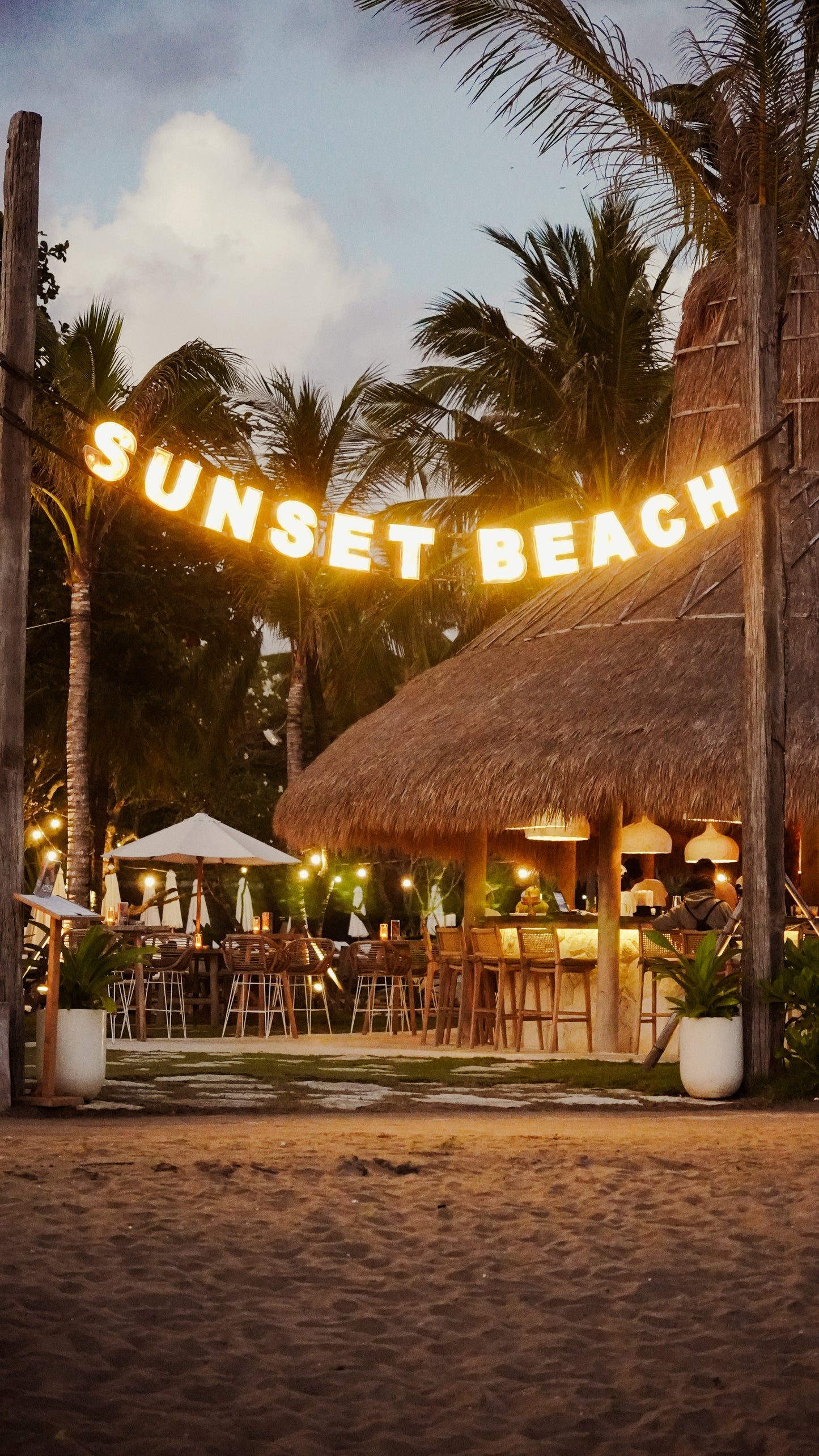 Sunset Beach Bali Seminyak Beach Club by Mrs Sippy Sign on Beach with Sunset Views Front